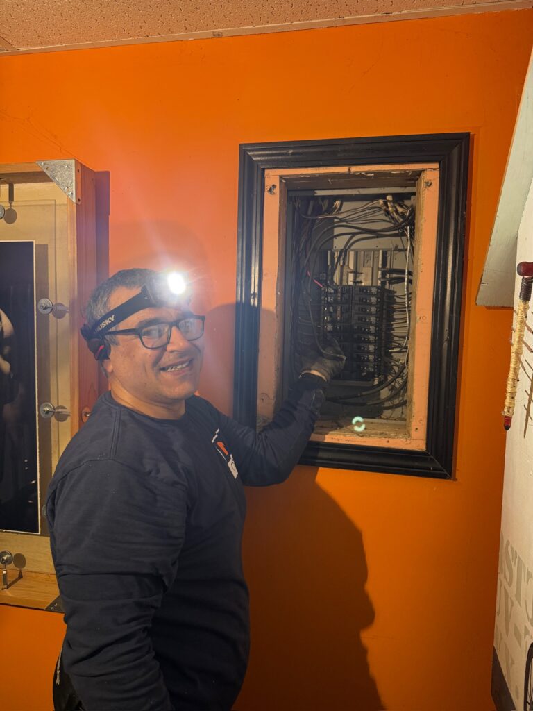 Nicks Electrical Services electrician working on an electrical panel