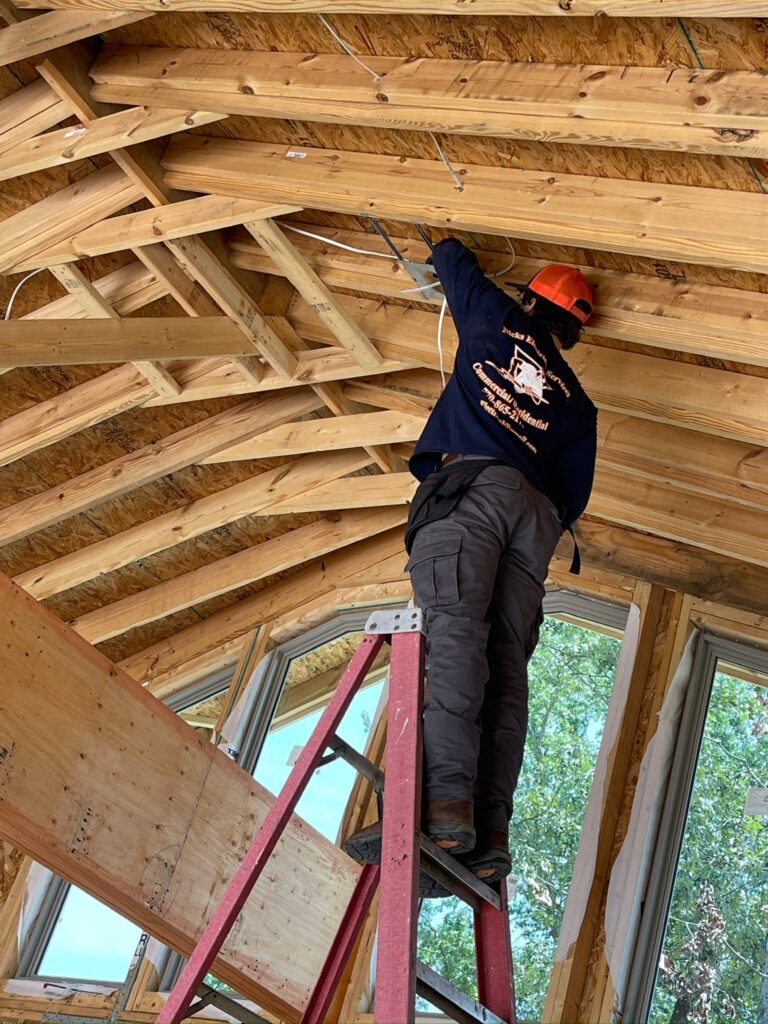Electrical rough-in wiring in new construction framing